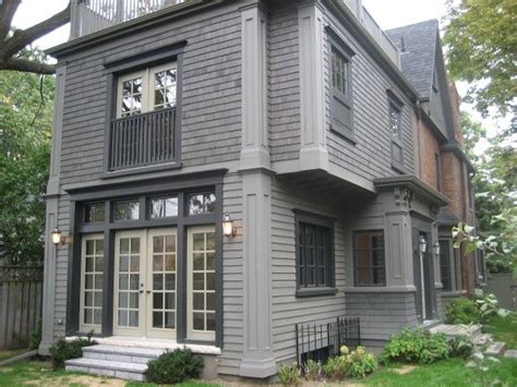 Contrasting colors sit perfectly with each other. Historic red brick home with grey addition. qummunicate ...