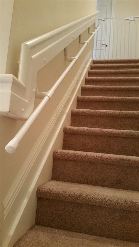 How to install stair handrail on stairs : DIY toddler handrail for stairway - pvc pipes secured to wall and existing handrail my two year ...