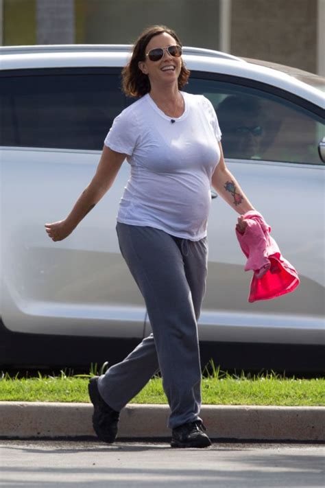 Pregnant Alanis Morissette Bumps Along In See Through White Tee During