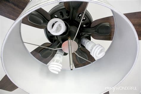 An electrician deactivates the electrical circuit before you start the job. DIY drum shade ceiling fan - Crazy Wonderful