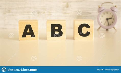 The Word Abc Consists Of Wooden Cubes With Letters Top View On A Light