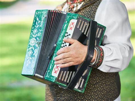 Russian Folk Instrument Accordion Harmonica In Hands Of Musician