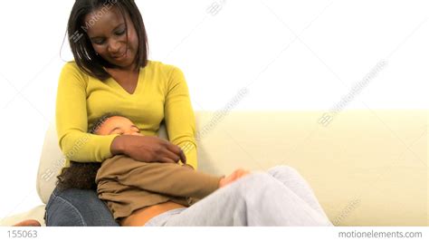 African American Woman Tickling Her Cute Daughter Stock Video Footage 155063