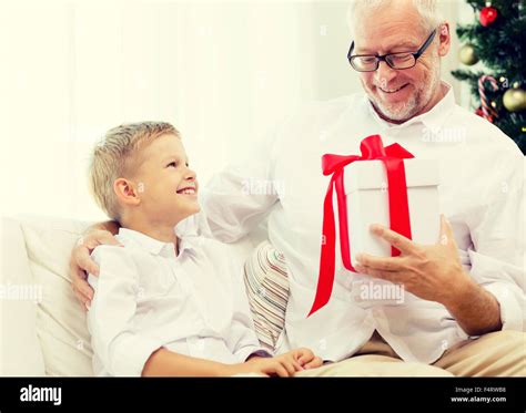Smiling Grandfather And Grandson At Home Stock Photo Alamy