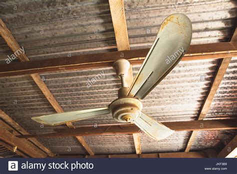 Ceiling fans are rather simple. Electric ceiling fan, old rusty ceiling fan on rusty on ...