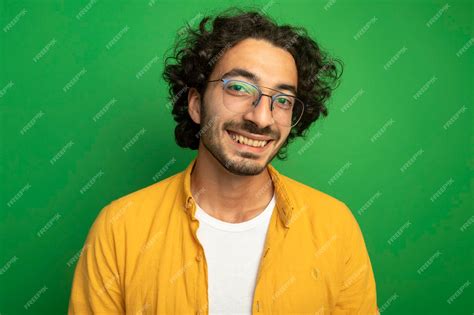 Free Photo Close Up View Of Smiling Young Handsome Man Wearing Glasses Looking At Front