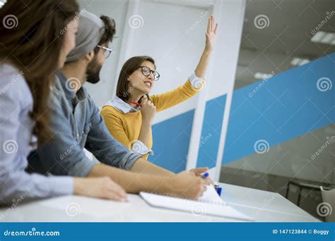 Students Rising Hands To Answer The Question During The Workshop