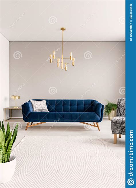 Minimal Living Room Interior With A Blue Sofa And Lots Of Empty Space