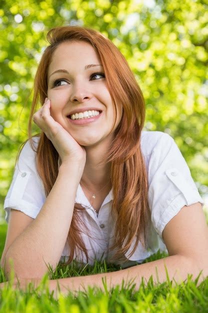 Premium Photo Pretty Redhead Relaxing In The Park