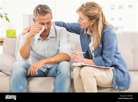Concerned Therapist Comforting Crying Male Patient Stock Photo Alamy