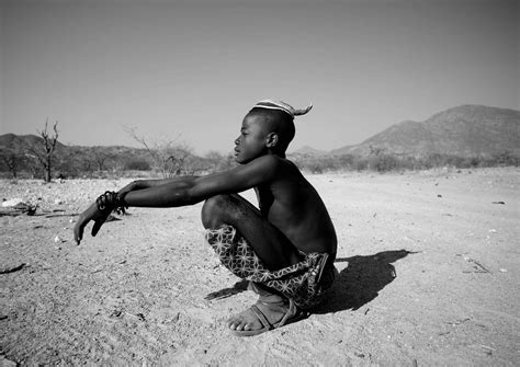 He works she works it works. Muhimba tribe boy - Angola | He was walking in a remote ...