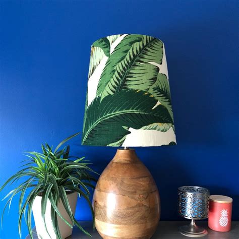 How dreamy is this coastal bedroom with the bed hanging from ropes from the ceiling? Tropical Decor Palm Tree Lamp Shade in 2020 | Green lamp ...