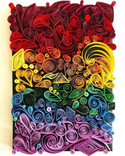 An Art Piece Made Out Of Paper With Different Colors And Shapes On The
