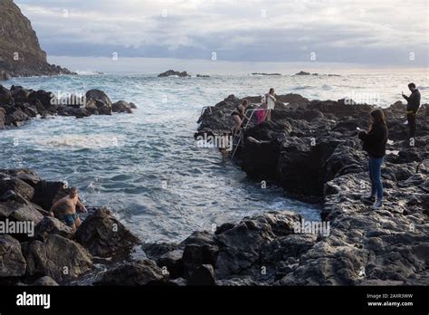 sao miguel azores february 2020 natural hot spring at ponta da ferraria where people swim in