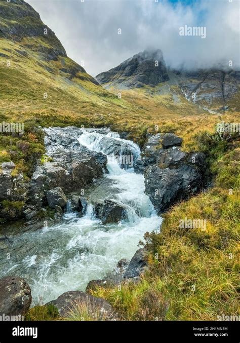 A Waterfall On The Allt Na Dunaiche River Below The Mountain Slopes Of