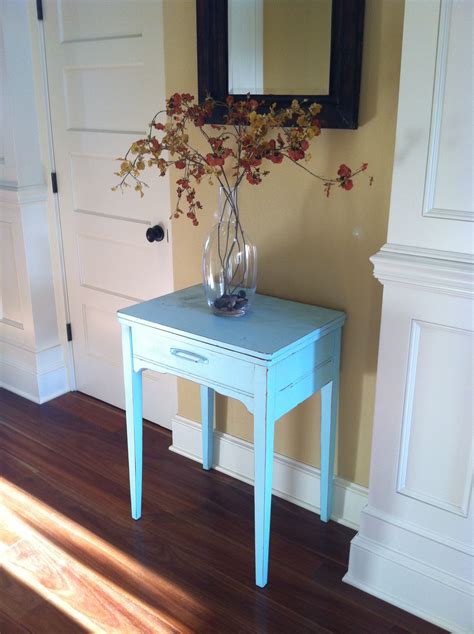Maybe you would like to learn more about one of these? Vintage sewing machine cabinet painted blue, welcoming ...
