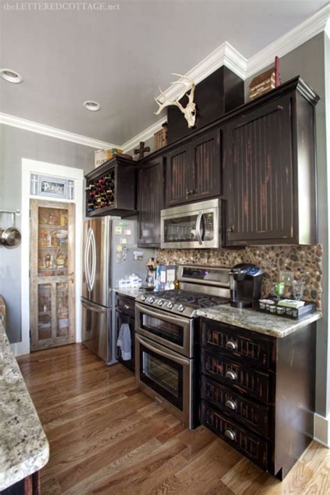 The rustic atmosphere in this kitchen is very strong, because not only that the cabinets made of wood planks, but also the entire ceilings and flooring are made of the same materials. Marvelous 30 Interesting Modern Rustic Kitchen Design Ideas of Your Dreams https://decoor.net/30 ...