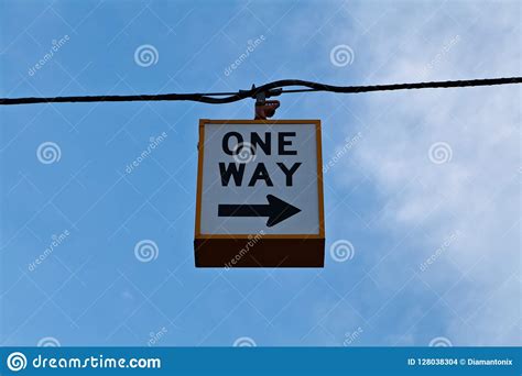 One Way Sign On The Blue Sky Background Stock Photo