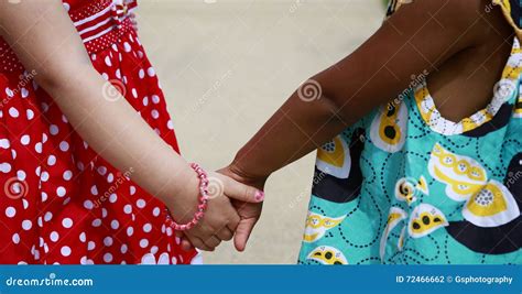 Two Girls Holding Hands Stock Photo 72466662