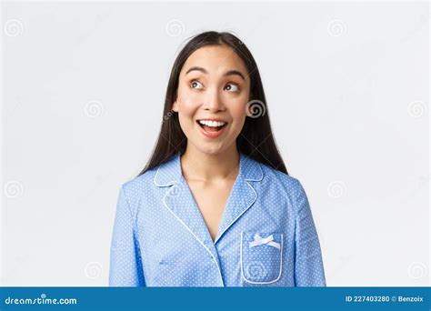 Close Up Of Excited Beautiful Asian Girl Hearting Amazing Announcement