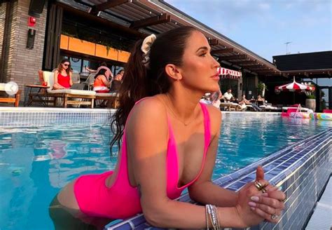 Kaitlyn Bristowe Stuns In Hot Pink Open Back Swimsuit