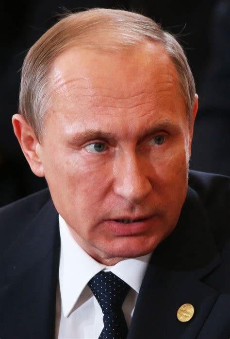 The heels explain his habit of wearing suit. How Tall is Valdimir Putin - How Tall is Man?