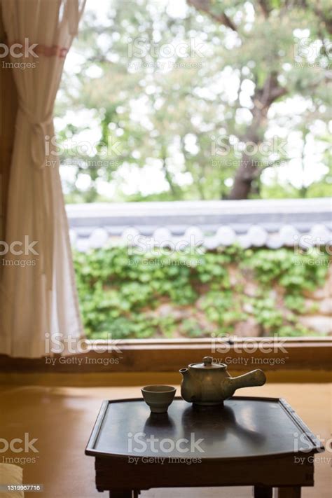Wooden Korean Tea Table With Traditional Korean House In The Historic