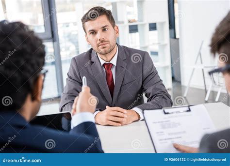 Attentive Businessman Listening To Colleagues During Job Interview