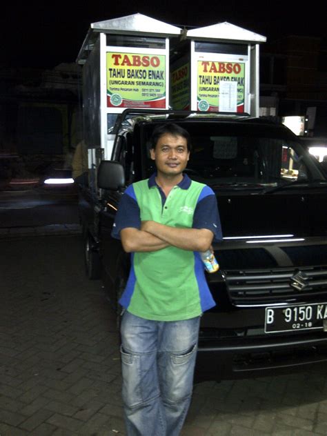 a man standing in front of a food truck