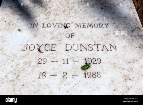In loving memory inscription white marble grave hi-res stock