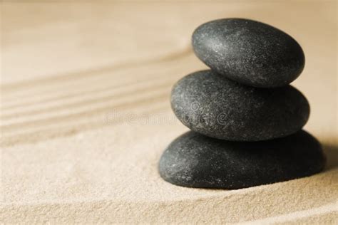 Stacked Zen Garden Stones On Sand With Pattern Space For Text Stock