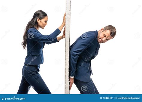 Businessman And Businesswoman In Suits Pushing Wall Stock Image Image
