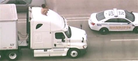 Naked Woman Atop Semi Ties Up Traffic For Hours