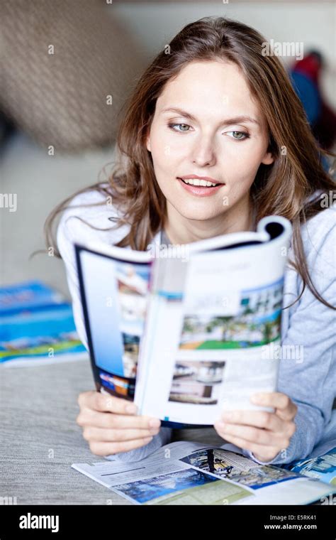 Woman Reading Magazine Stock Photo Alamy