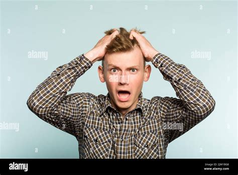 Shocked Worried Distraught Man Pull Hair Emotion Stock Photo Alamy