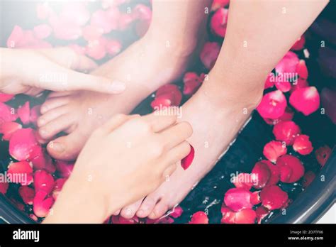 foot spa massage treatment by professional massage therapist in luxury spa resort wellness
