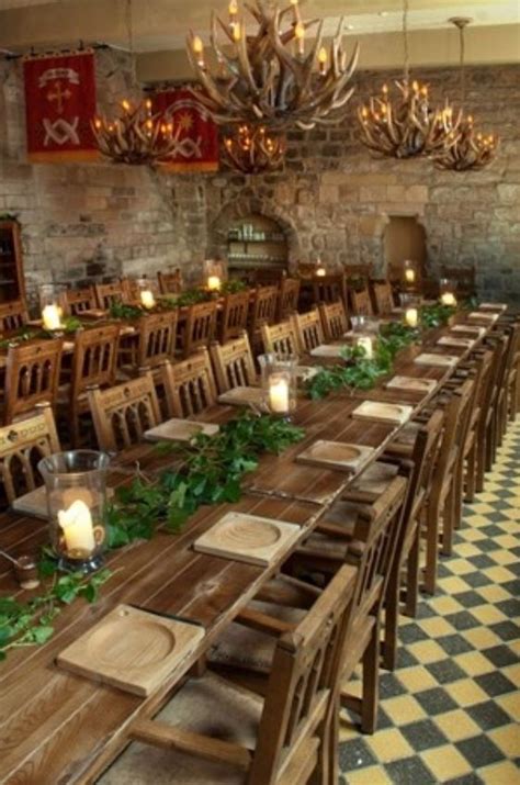 Long dinner tables plus rustic centre piece | Medieval wedding theme
