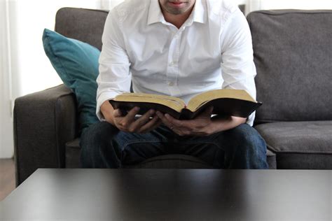 Free Stock Photo Of Man On Couch Reading Bible
