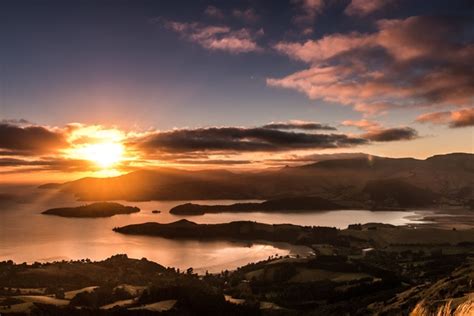 The large amount of flat land on the other side of the port hill, suitable for farming and. Lyttelton Harbour Sunrise Canterbury New Zealand - Photorator