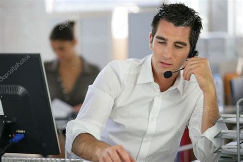 Young Man Telemarketer In Call Center Stock Photo By ©photography33 8556763