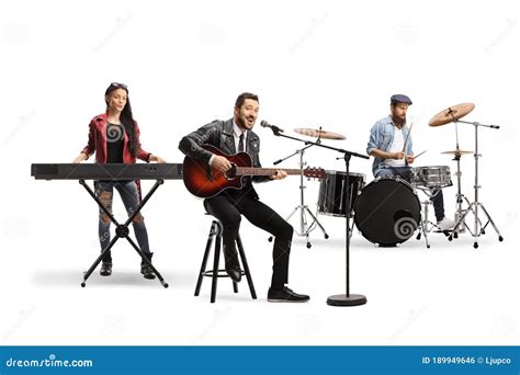People In A Music Band With An Acoustic Guitar Keyboard And Drums
