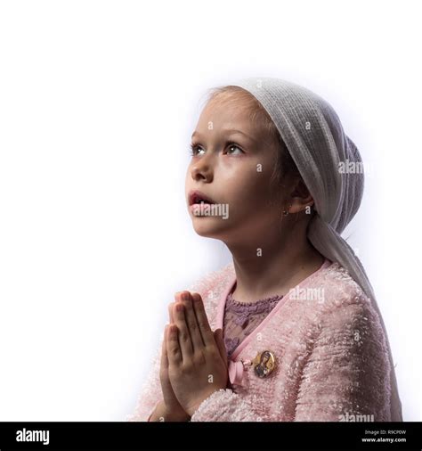 Close Up Portrait Of Young Girl Praying Isolated On White Stock Photo