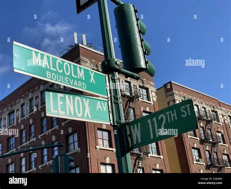 Malcolm X Boulevard On Lenox Avenue And West 112th St Street Sign In