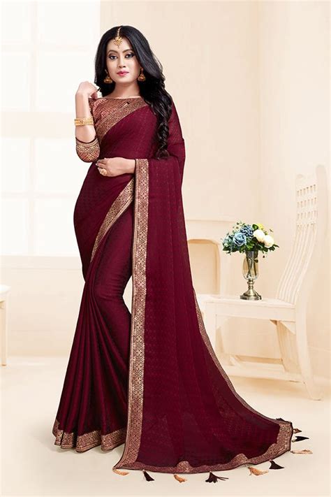 Here Is A Rich And Elegant Looking Designer Saree In Maroon Color Paired With Maroon Colored