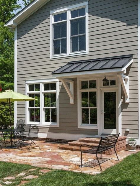 Porch overhangs help shield your house from the weather. Door overhang | House awnings, Awning over door, House ...