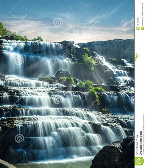 Tropical Rain Forest Landscape With Flowing Blue Water Of