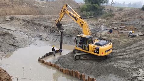 Installation Of Steel Sheet Piles With Excavator Youtube