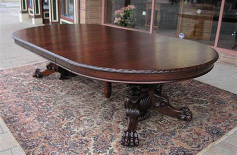 An oak claw foot round dining table and chairs. Ribbon Stripe Mahogany Lions/Claw Foot Dining Table
