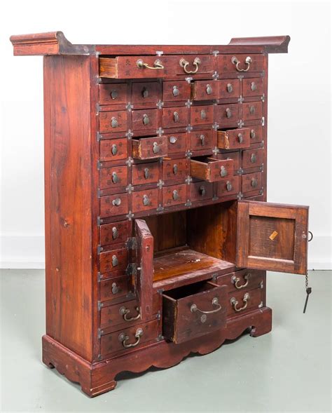The cabinet is handcrafted and structured with wooden pegs and tenon structure. Chinese Multi Drawer Apothecary Chest | 1stdibs.com ...