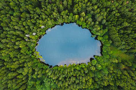 Aerial View Of Tiny Round Ice Age Lake In The Middle Of The Autumn